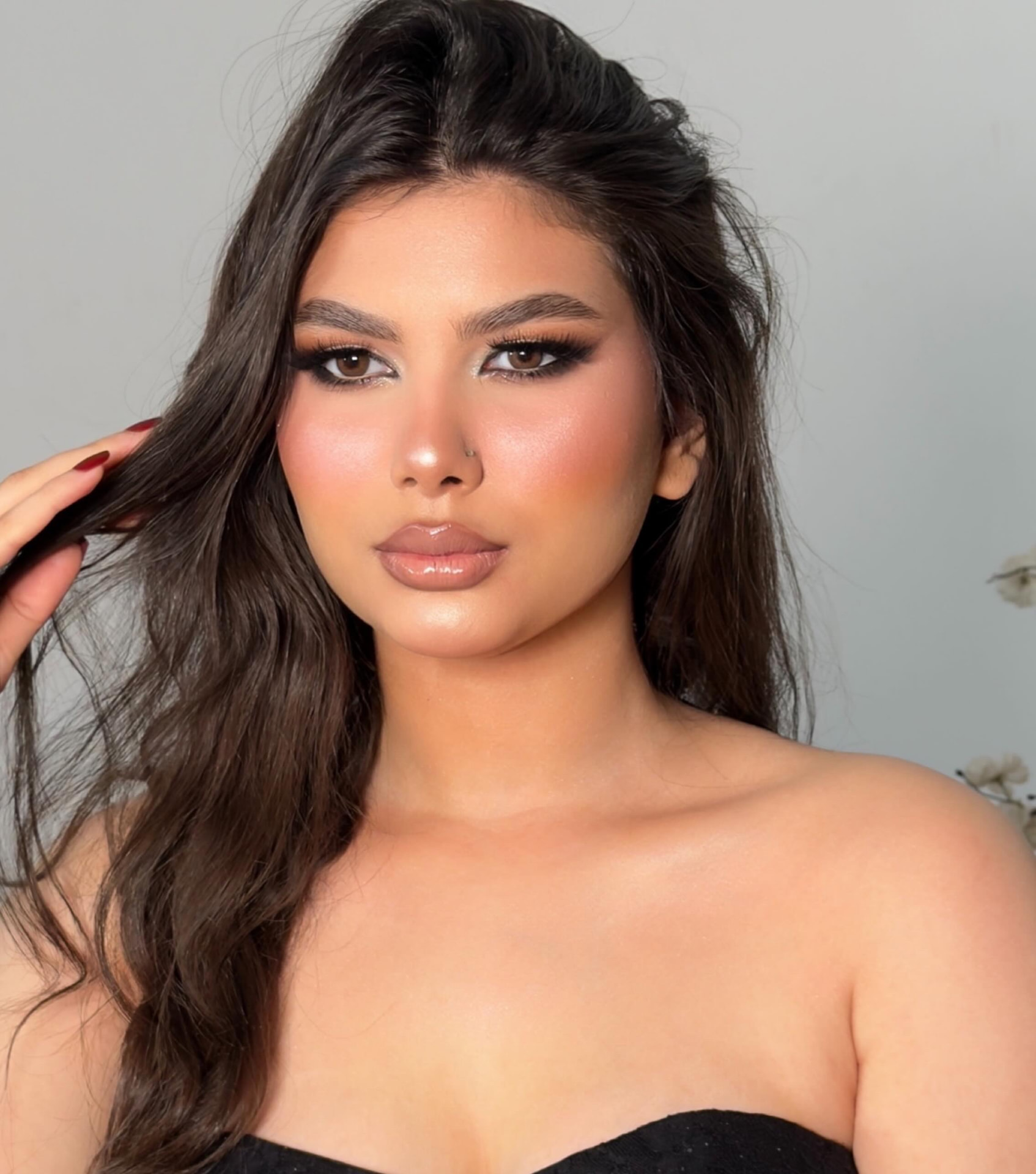 Glam look with smokey golden eyes and glossy nude lips